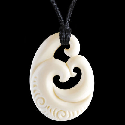 Family Koru with carved patterning, hand crafted bone pendant
