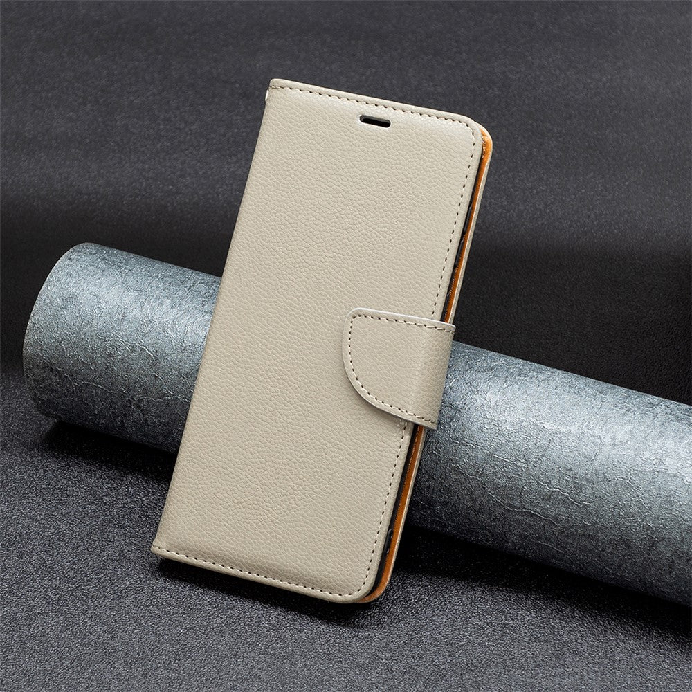 For iPhone 15 Plus Wallet Case with Wrist Strap Litchi Texture Leather Phone Stand Cover