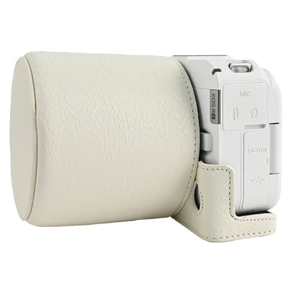 For Canon EOS R50 V Camera Half Case Litchi Texture Battery Opening PU Leather Cover with Shoulder Strap and Lens Cap