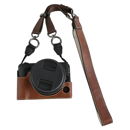 For Canon EOS R50 V Camera Half Case Litchi Texture Battery Opening PU Leather Cover with Shoulder Strap
