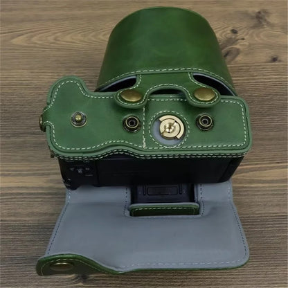 For Canon EOS R50 / R100 PU Leather Camera Case Battery Opening Design Camera Cover with Strap and Small Bag