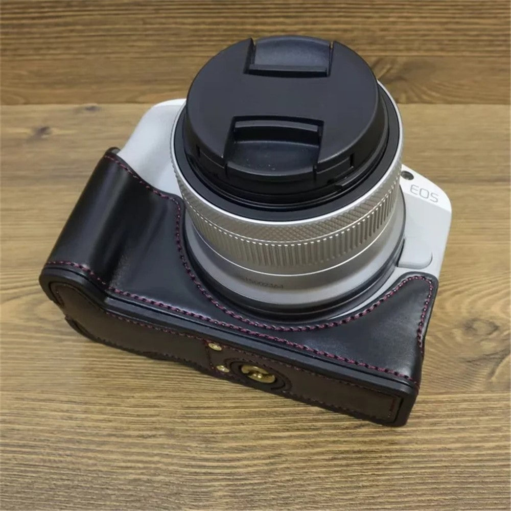 For Canon EOS R50 / R100 PU Leather Bottom Case Half Body Camera Cover with Wrist Strap