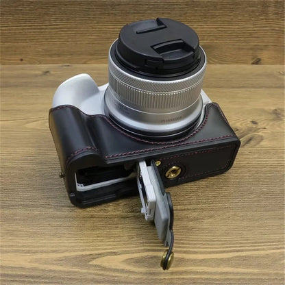 For Canon EOS R50 / R100 PU Leather Bottom Case Half Body Camera Cover with Wrist Strap