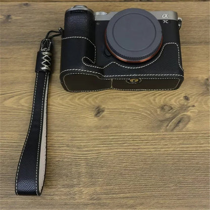 For Sony A7C II / A7CR Camera Bottom Case PU Leather Anti-Drop Half Body Cover with Wrist Strap