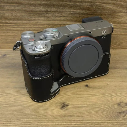 For Sony A7C II / A7CR Camera Bottom Case PU Leather Anti-Drop Half Body Cover with Wrist Strap