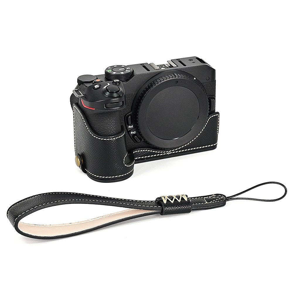 For Nikon Z30 / Z50 Battery Opening Design PU Leather Camera Cover Palm Texture Half Body Bottom Case with Wrist Strap