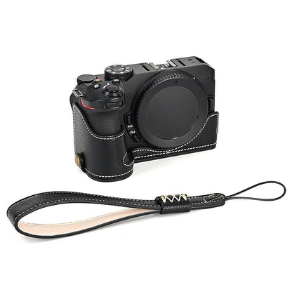 For Nikon Z30 / Z50 Battery Opening Design PU Leather Camera Cover Palm Texture Half Body Bottom Case with Wrist Strap