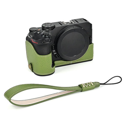For Nikon Z30 / Z50 Battery Opening Design PU Leather Camera Cover Palm Texture Half Body Bottom Case with Wrist Strap