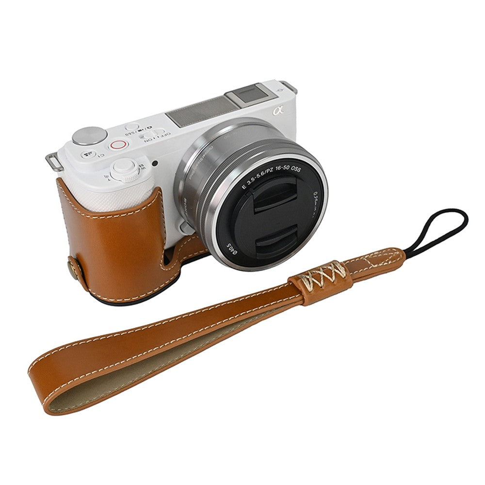 For Sony ZV-E10 Battery Opening Design PU Leather Camera Cover Half Body Bottom Case with Wrist Strap