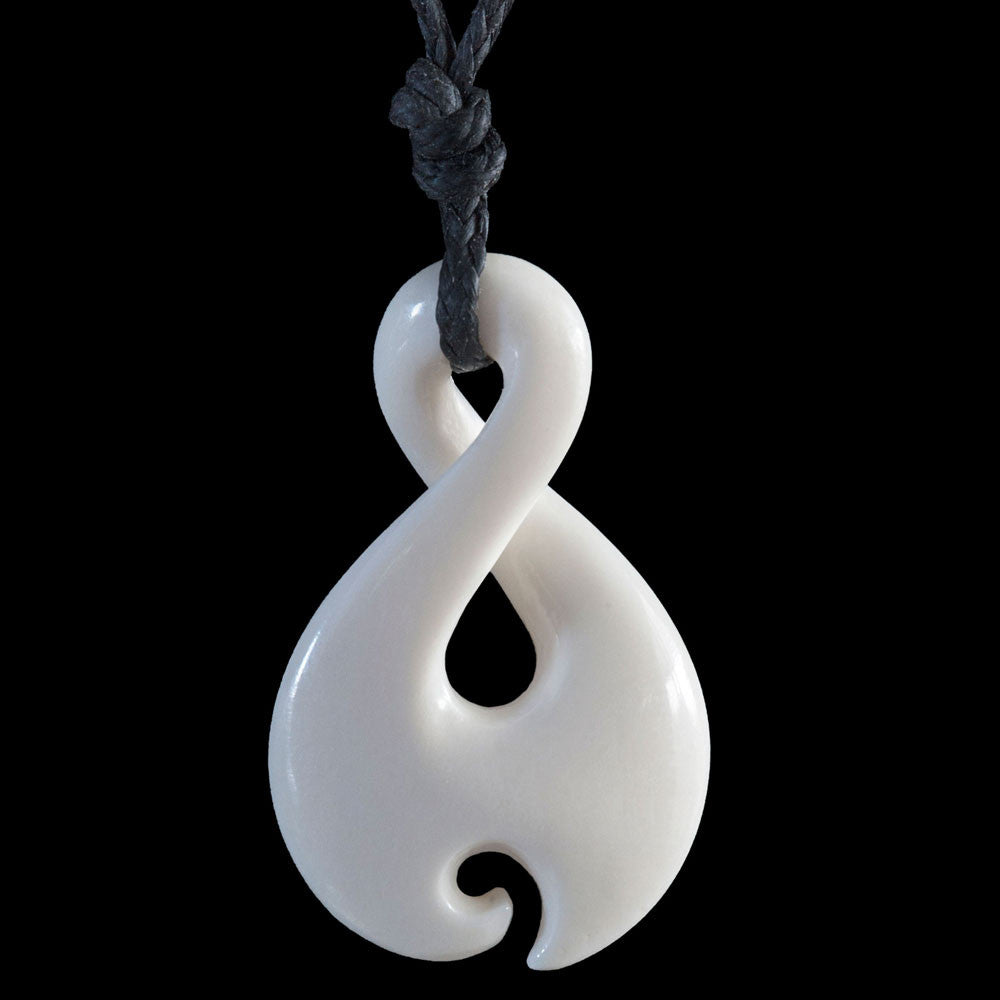 Small Twist Koru, hand-crafted bone pendant