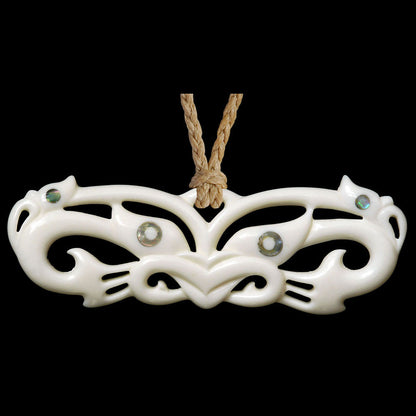 large Wheku Mask Manaia, pekapeka style bone pendant