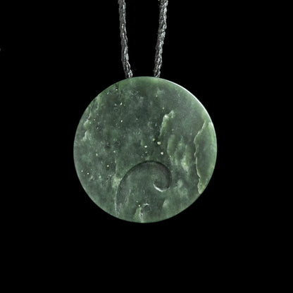 Jade disc pendant with korus by Nick and Mady Necklace