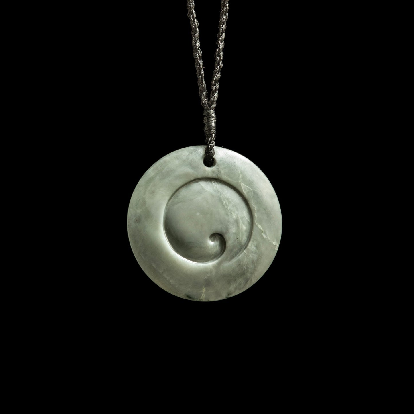 Jade disc pendant with korus by Nick and Mady Necklace