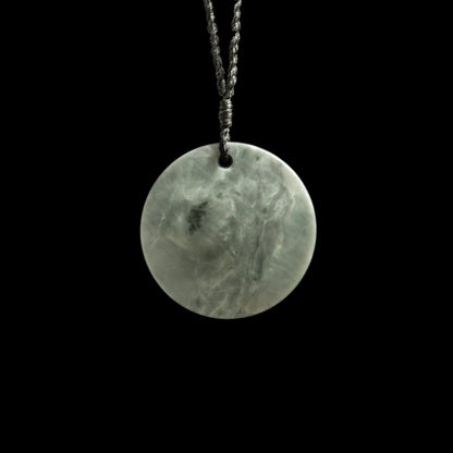 Jade disc pendant with korus by Nick and Mady Necklace
